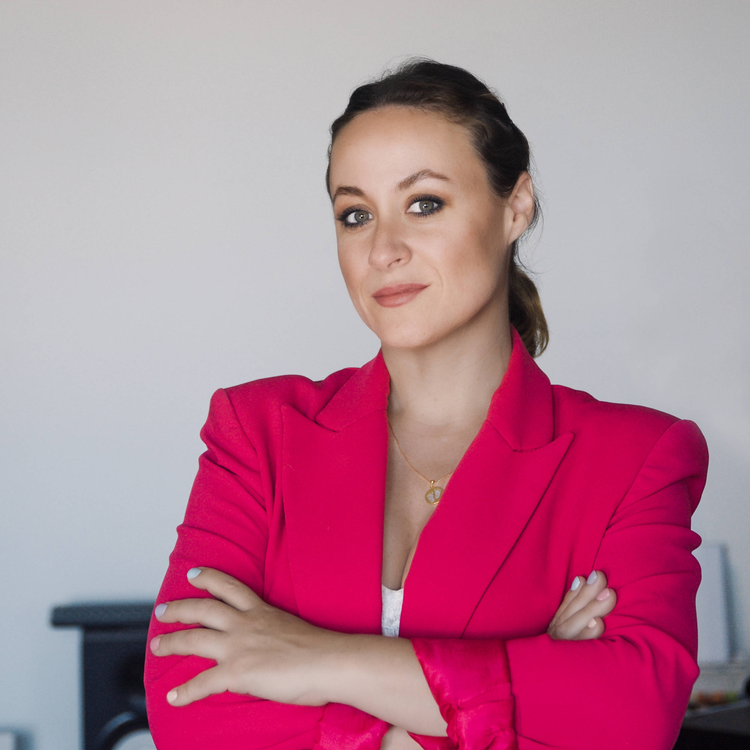 Bea Cabrera's portrait wearing a bright strawberry jacket